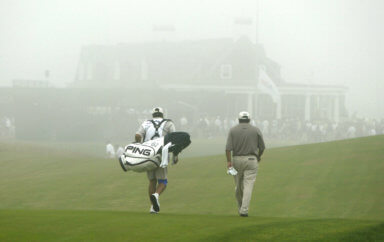 ANGEL CABRERA AND HIS CADDY WALK OFF THE COURSE AT SHINNECOCK HILLS GOLF CLUB.