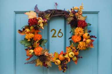 Thanksgiving wreath hanging on residential door