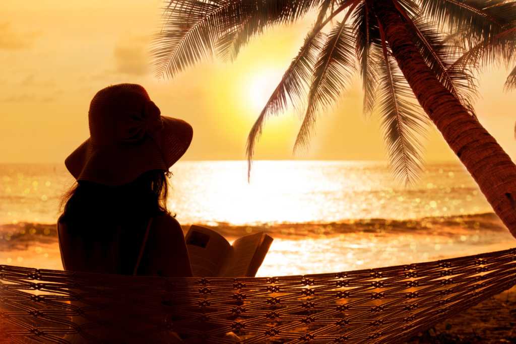 Silhouette of young lady at sunset