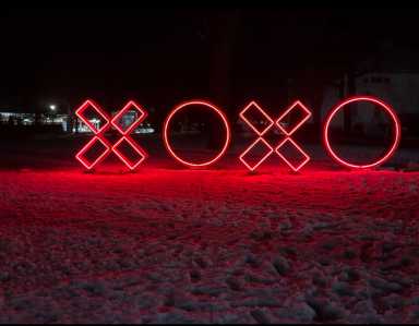 XOXO sculpture in Southampton at night