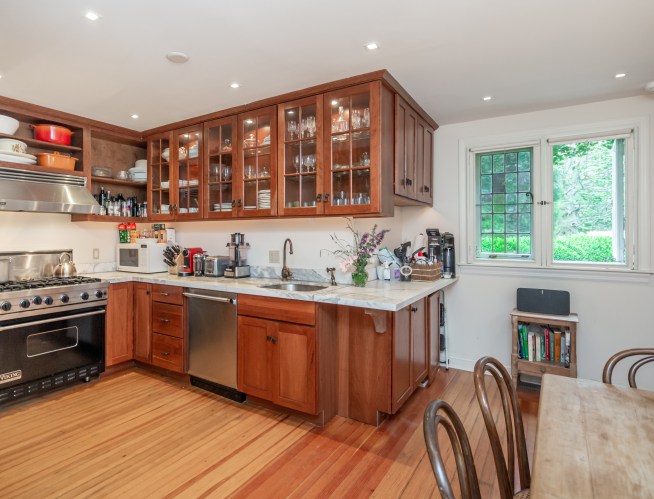 The recently renovated kitchen gives the home a modern appeal while maintaining its historical elegance.