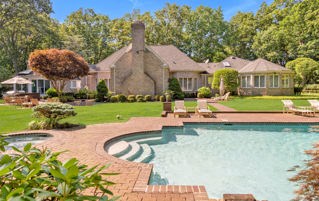 Also in Oyster Bay Cove, a five-bedroom custom-built brick expanded ranch that features a pool and pool house closed at $2.435 million.