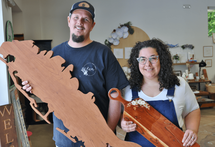 The Nagorskis with a decorative Long Island cutout and a custom cutting board.